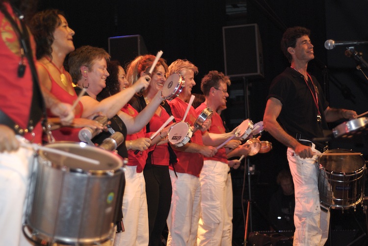 A samba percussion group performing on stage