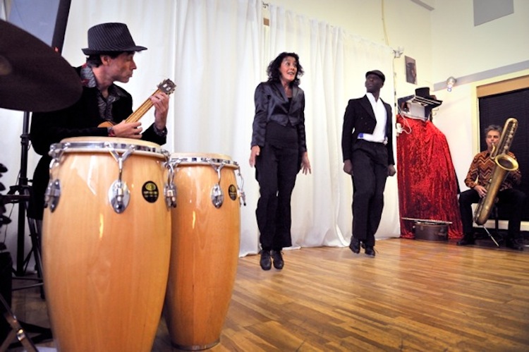 Michael playing congas in a performance setting