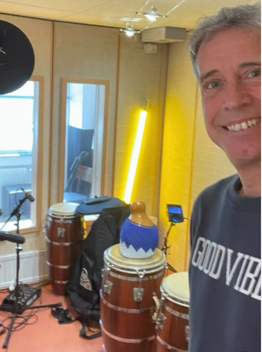 Michael in the studio with congas